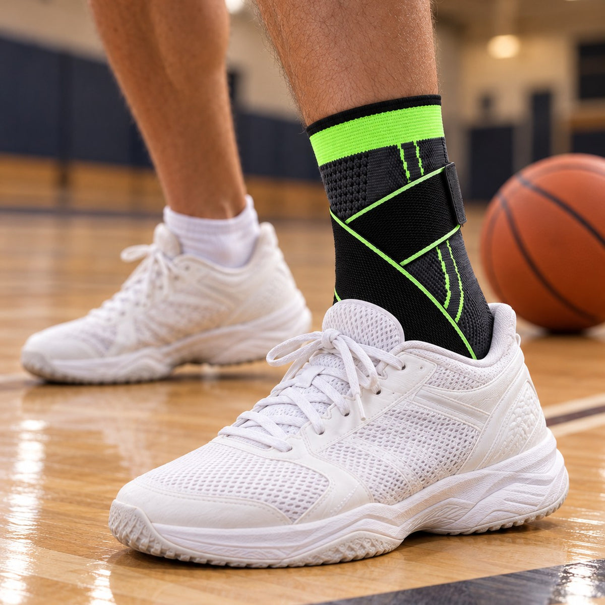 Green Corestride ankle sleeve worn with white sneakers on an indoor basketball court